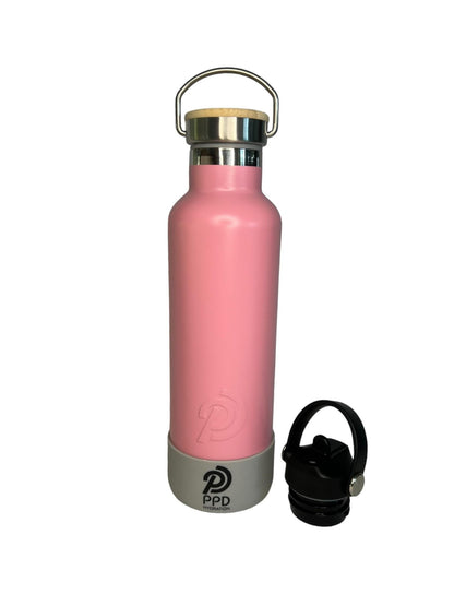 750ml 24oz light pink stainless steel insulated water bottle with grey bumper and sports lid on side